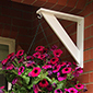 Instead of throwing those extra brackets away use them to decorate your home for either a hanging basket or bird feeder!